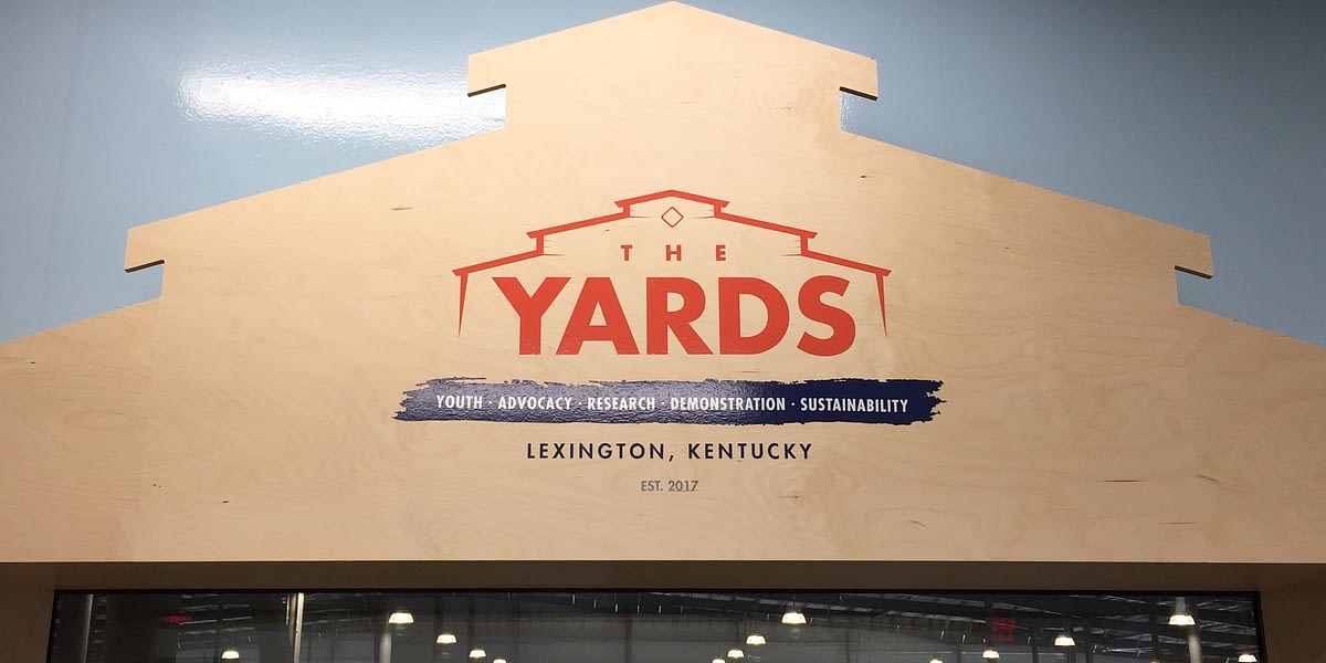 The Yards wood sign and graphic